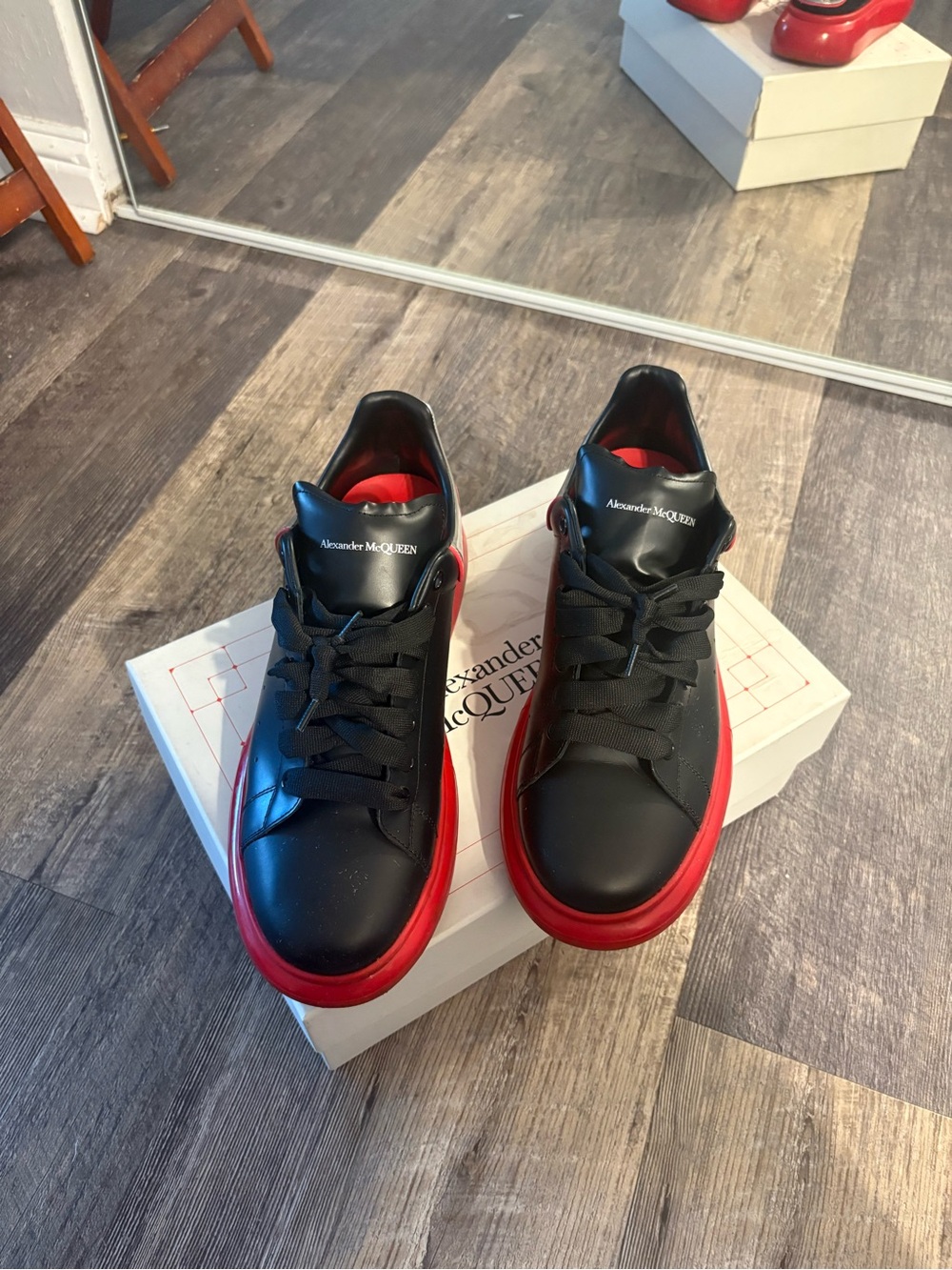 Alexander McQueen Black Leather Sneakers with Red Soles
